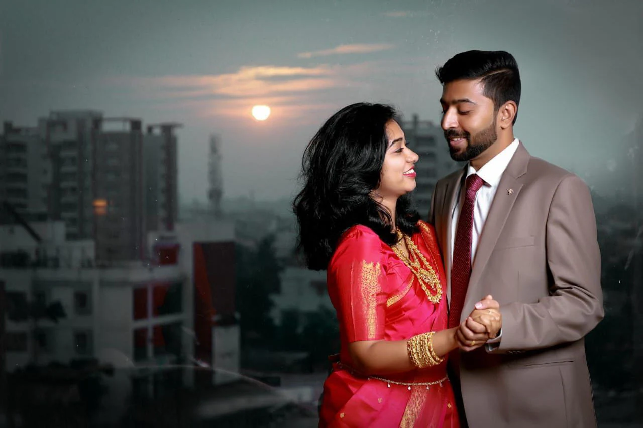 Couple smiling towards each other with a city skyline behind them