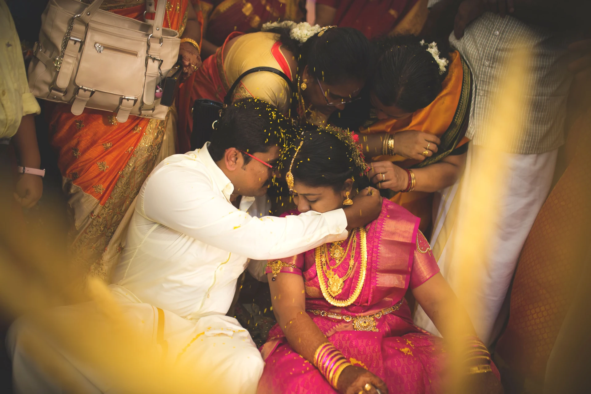 Couple surrounded by people during their wedding ceremony
